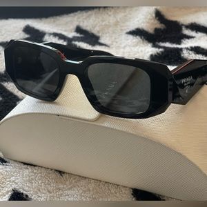 Prada Symbole sunglasses. Used but in great condition. Comes with the case.